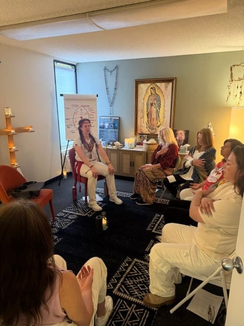 Marilyn leading a group healing circle in the Rosa Mystica studio