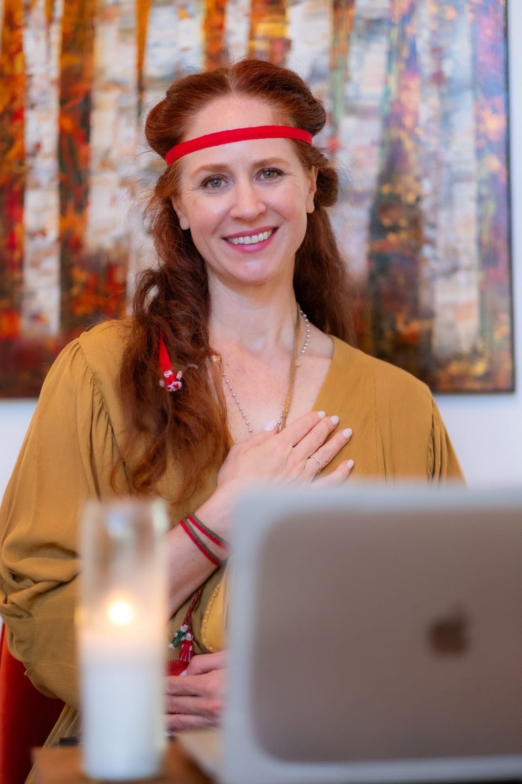 Marilyn smiling with her hand on her heart during an online spiritual life guidance session